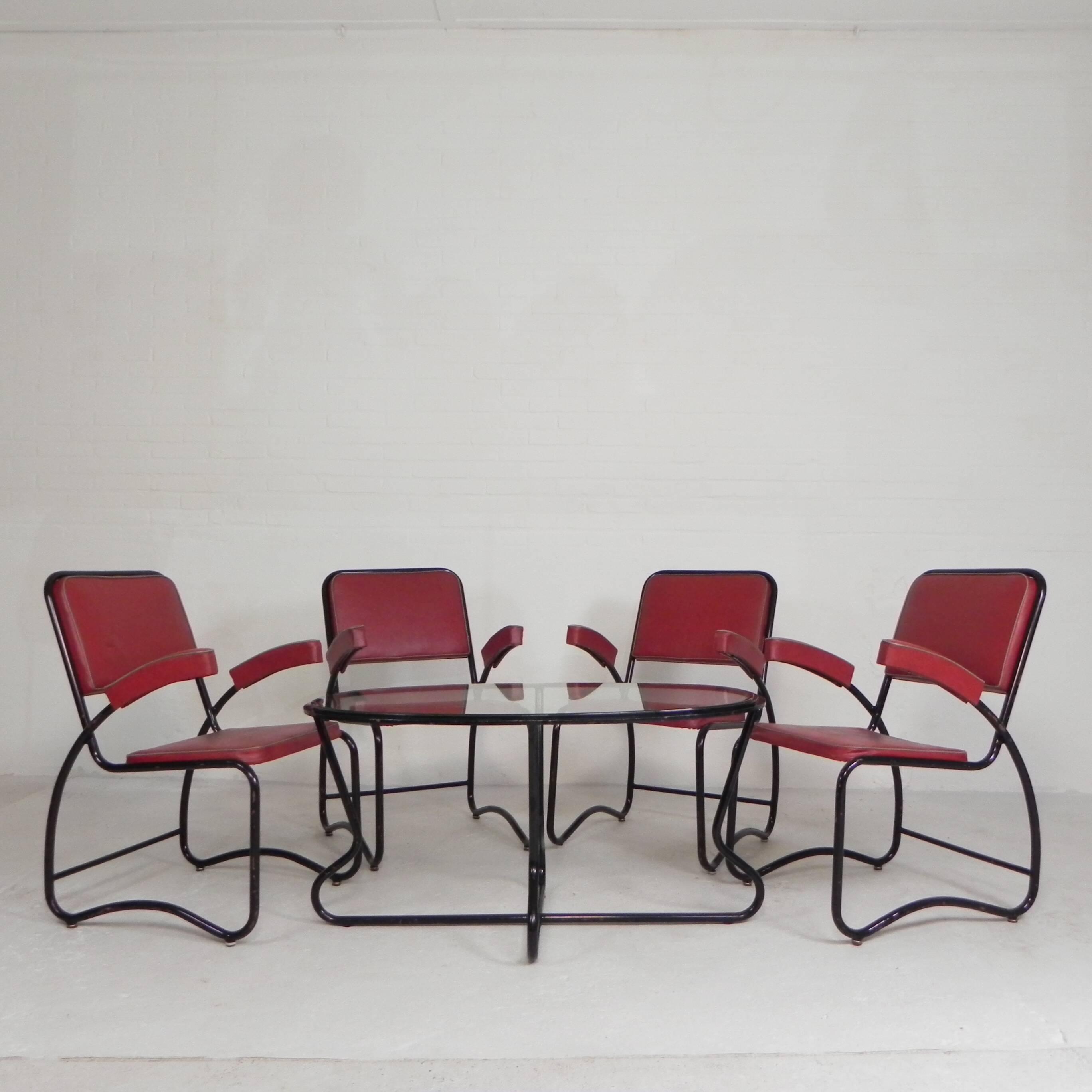 Set of 4 armchairs and a coffee table with tubular structure in Bauhaus style, 1950s.