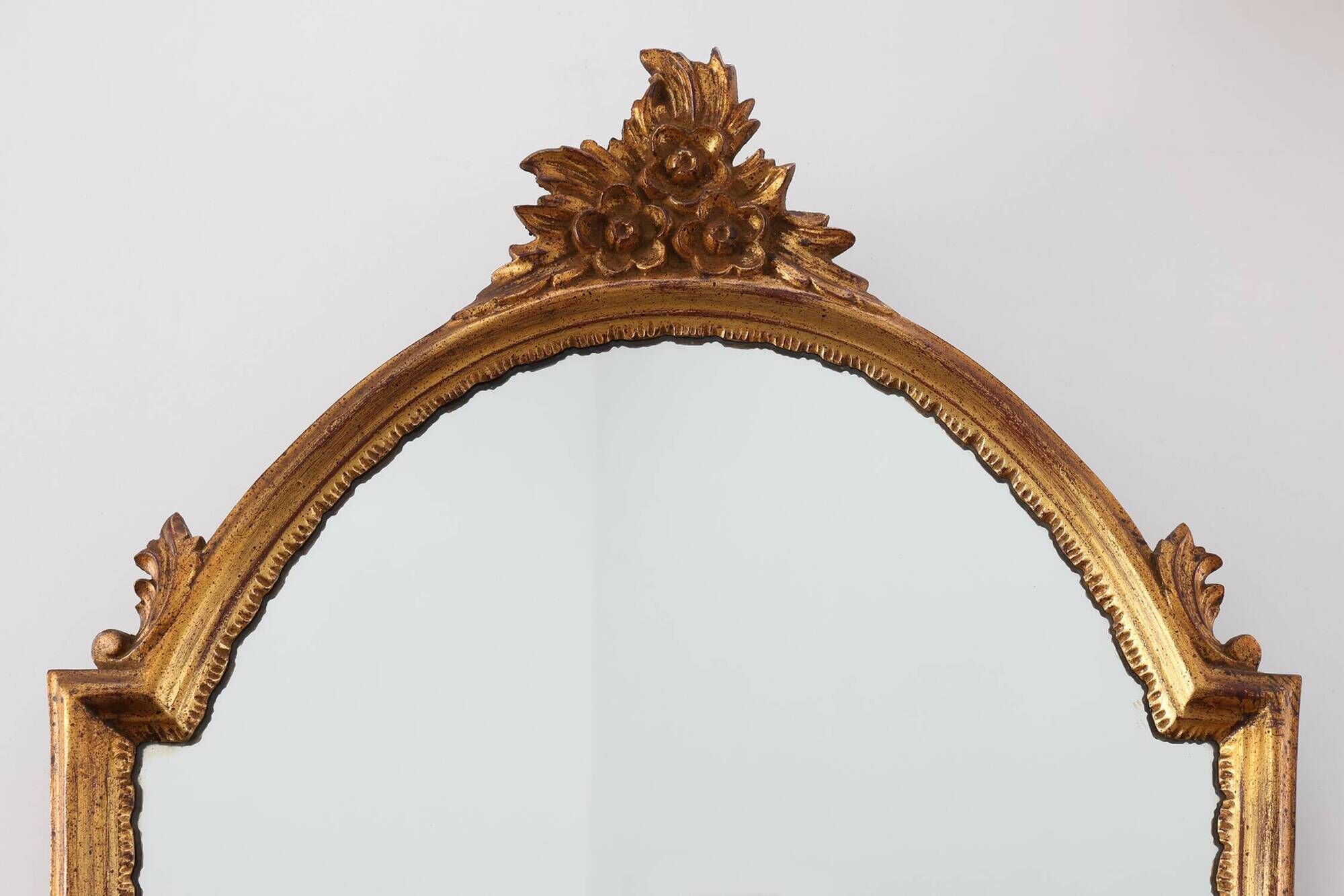 20th Century Louis XVI style giltwood mirror with ornate crest, France