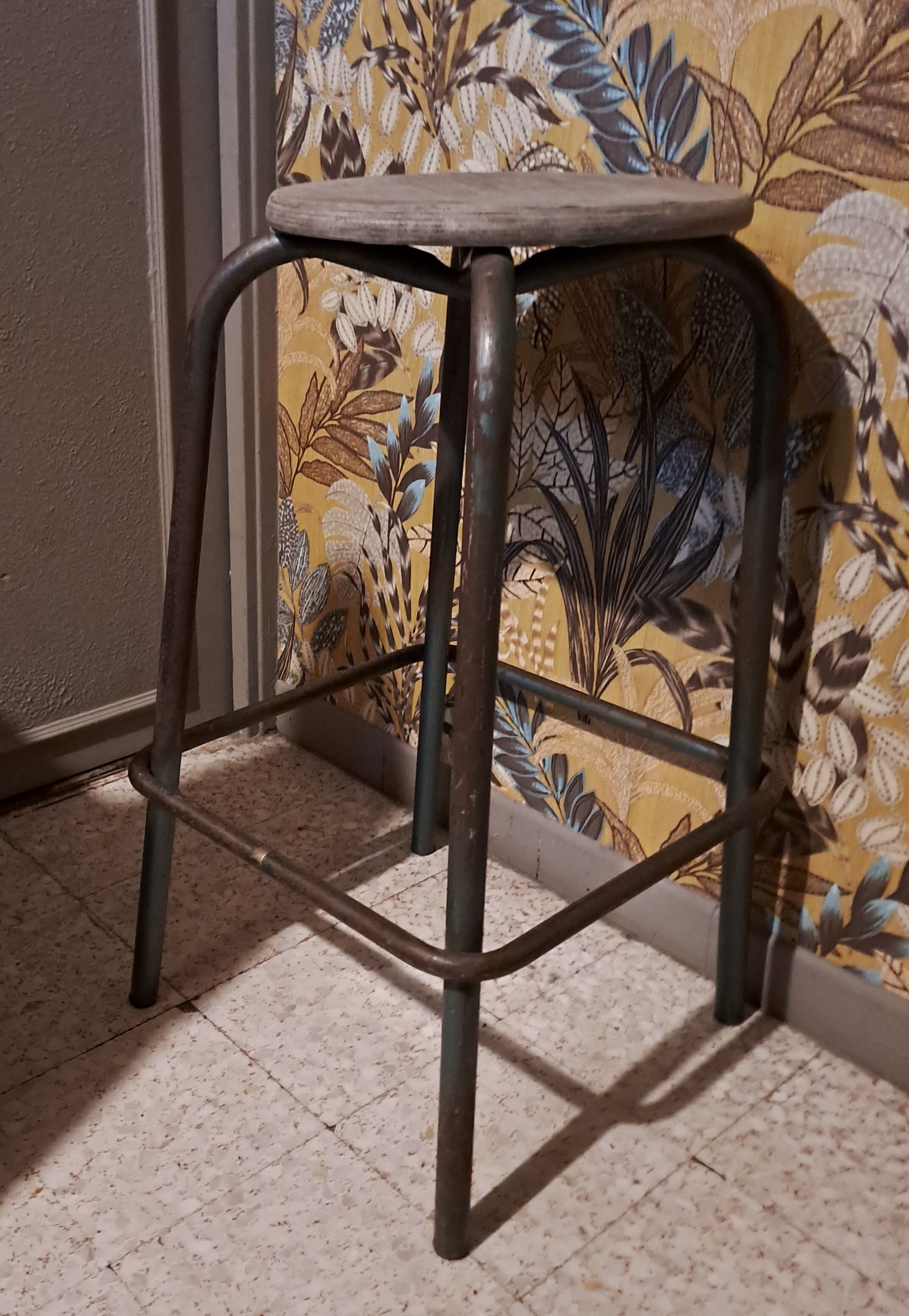High metal stool and wooden seat Labo style dating from the 1940s industrial style