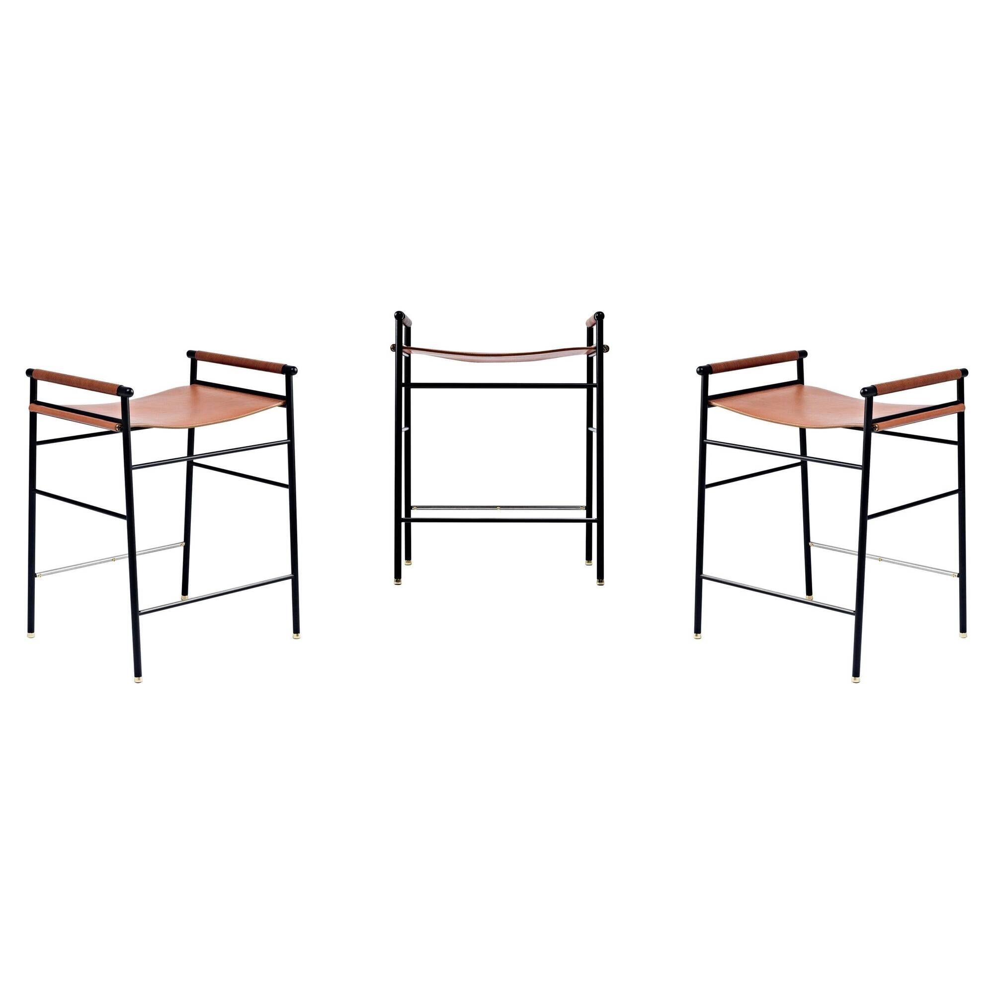 Set of 3 contemporary bar stools in natural brown leather and black rubber.