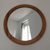 Round mirror in varnished pine