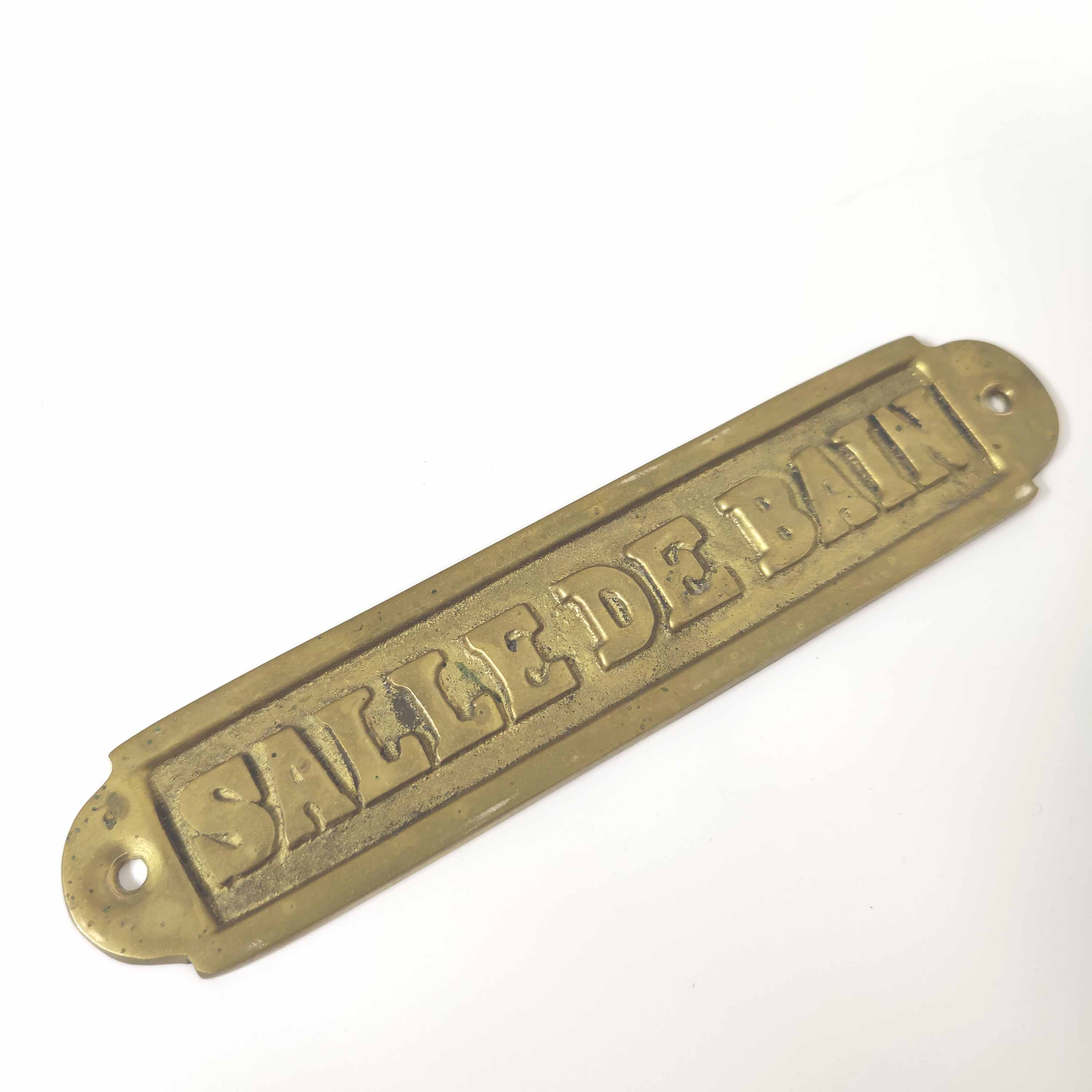 Brass bathroom door plate