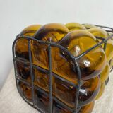 Glass carafe encased in wrought iron