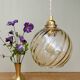 Suspension globe vintage en verre ambré