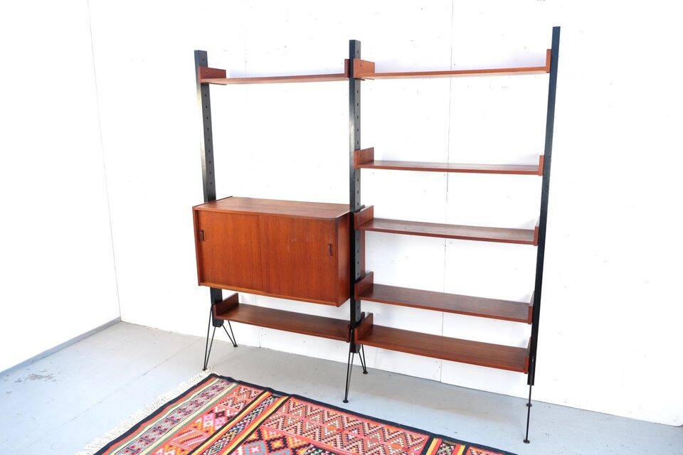 Vintage teak shelving system in 60s-70s style, retro style.
