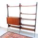 Vintage teak shelving system in 60s-70s style, retro style.