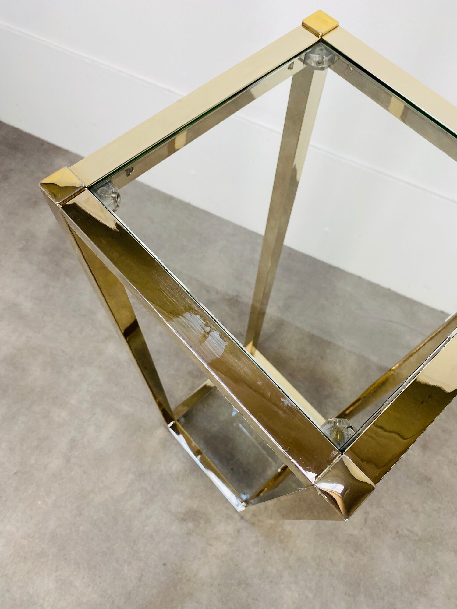 Gilded metal fifth wheel column and Hollywood Regency style glass 70s