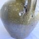 Ancient oil jar in glazed terracotta, khaki green — Auvergne, Lezou