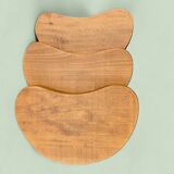 Trio of solid wood "bean" coffee tables