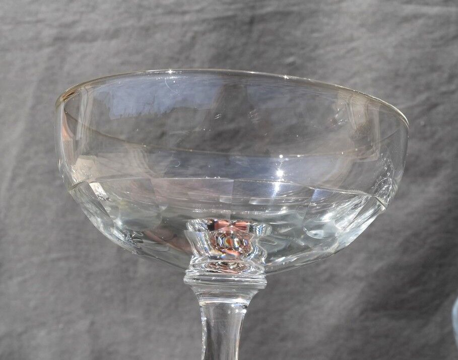9 old champagne glasses in flat-waisted blown glass