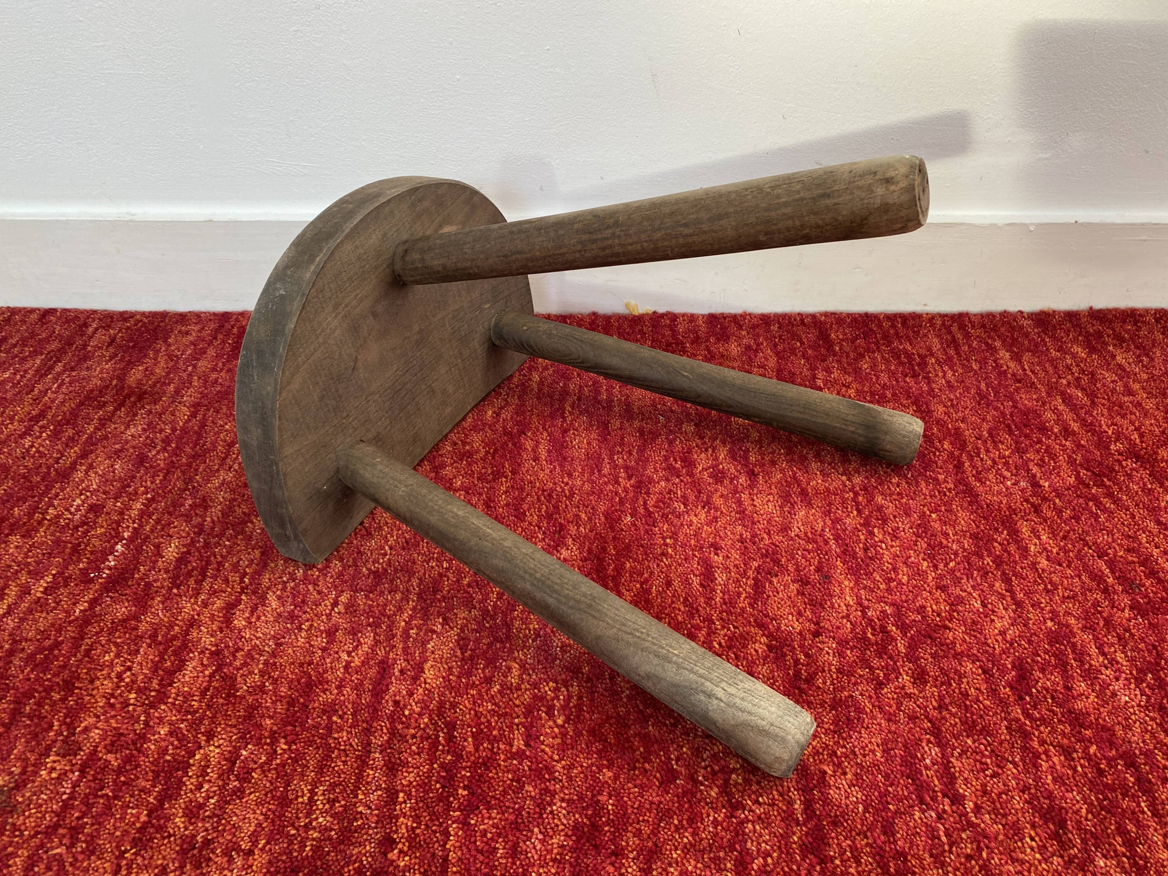 Old wooden tripod stool