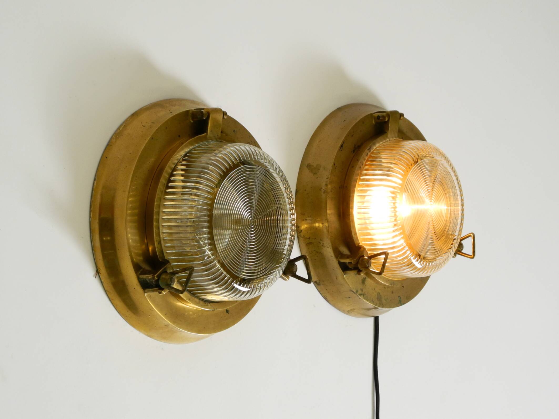 A pair of large, heavy 50s maritime ship wall lamps made of brass and glass