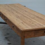 Old canteen in pine table