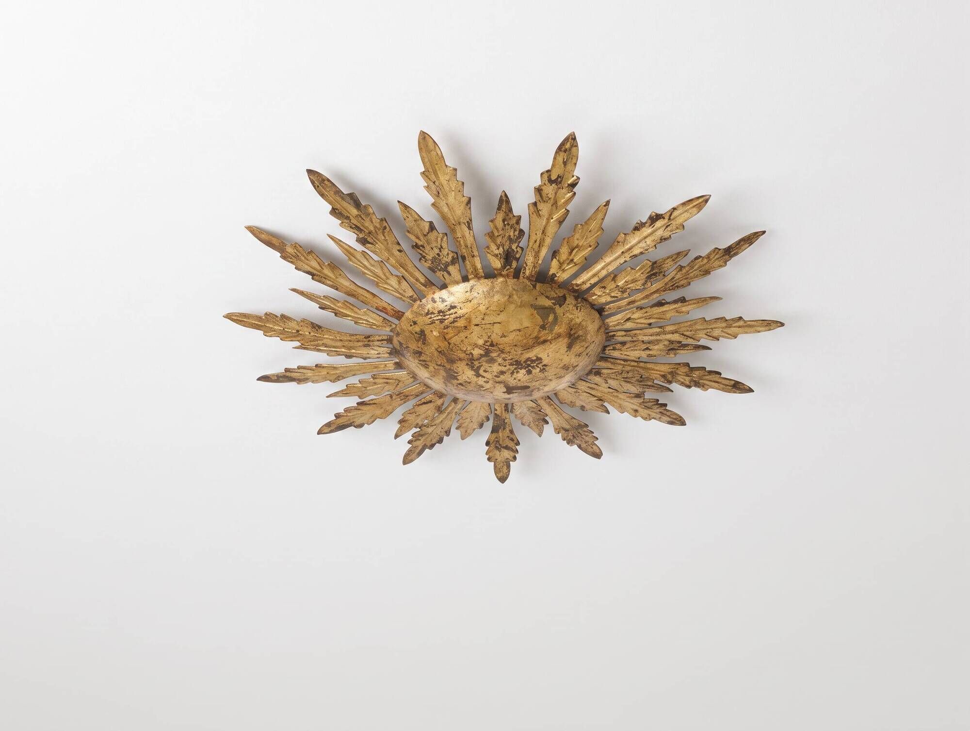 Mid-century sun ceiling lamp in gilded metal with leaf rays, 1950s