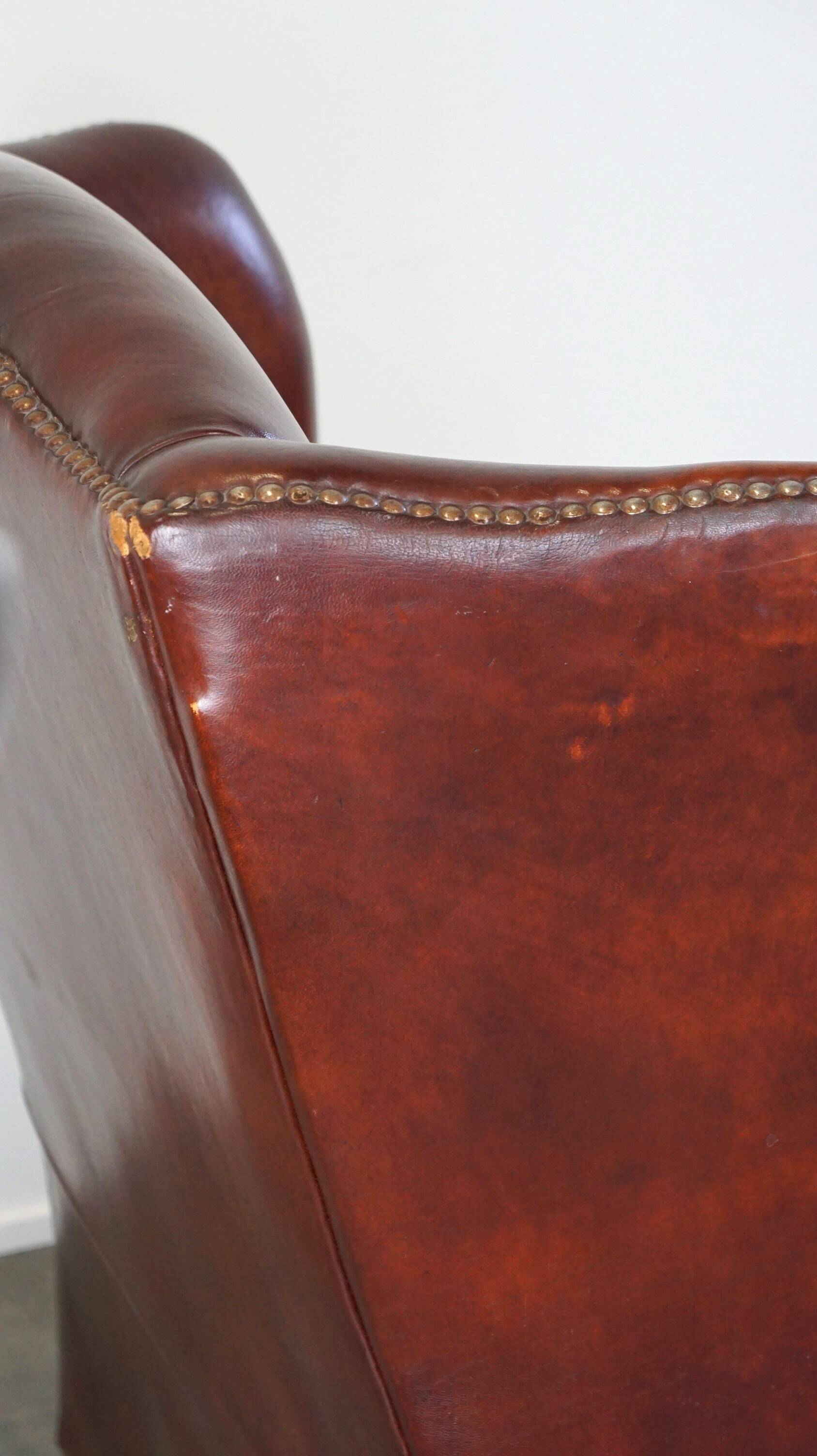 Large comfortable sheepleather wingchair in good condition and beautiful colours