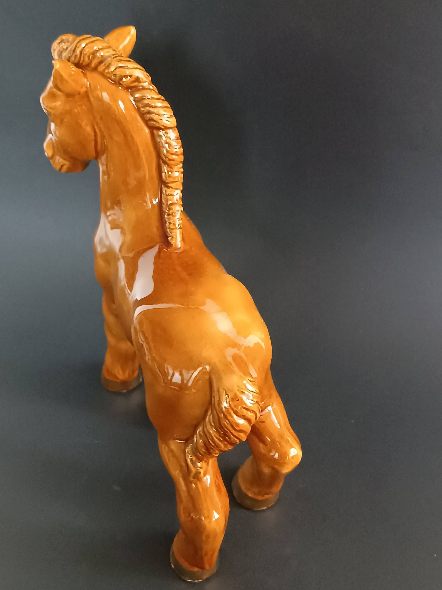 Ceramic horse sculpture with wild glaze and gold, signed Art Deco.