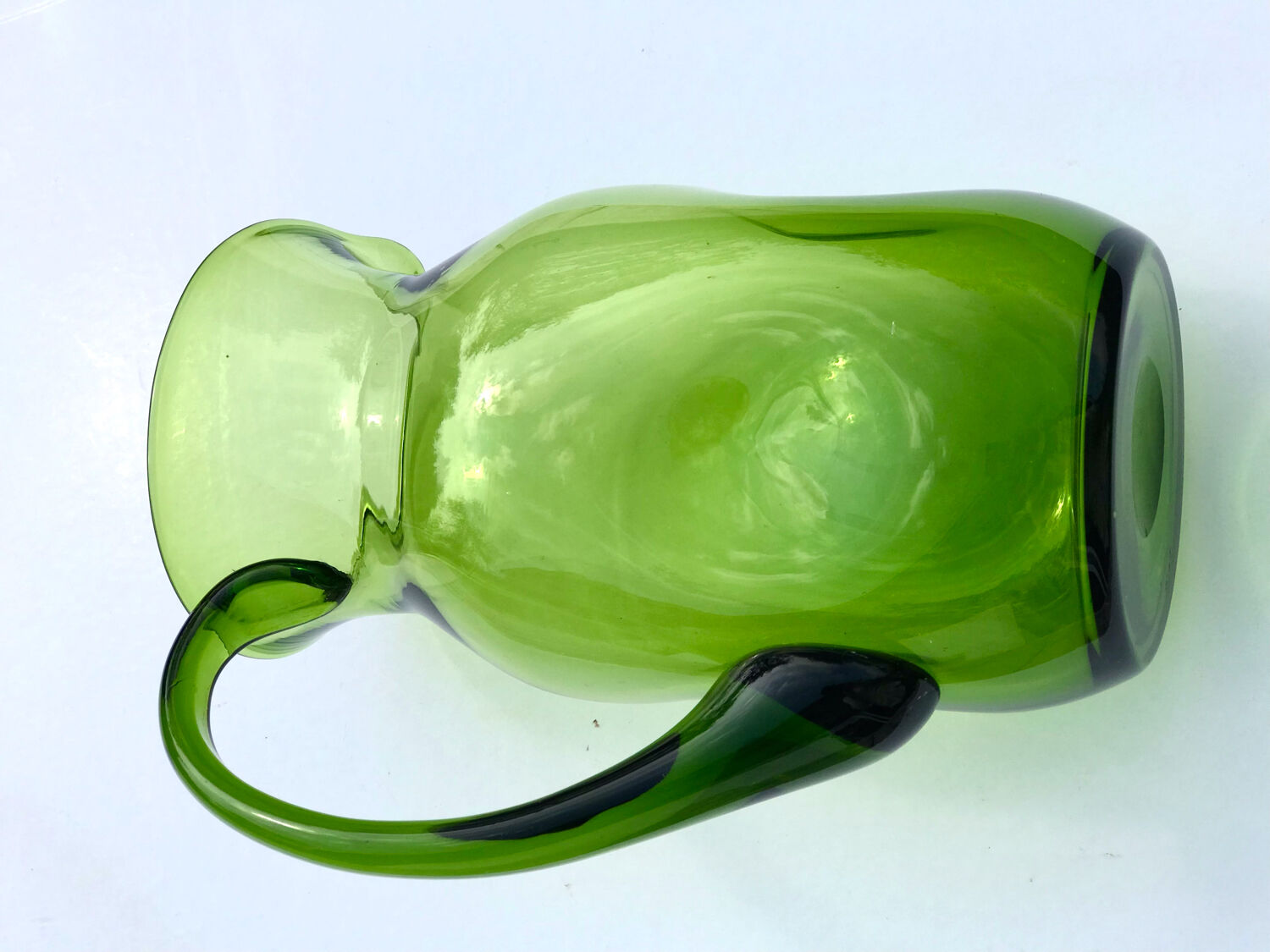 Green water jug in blown glass