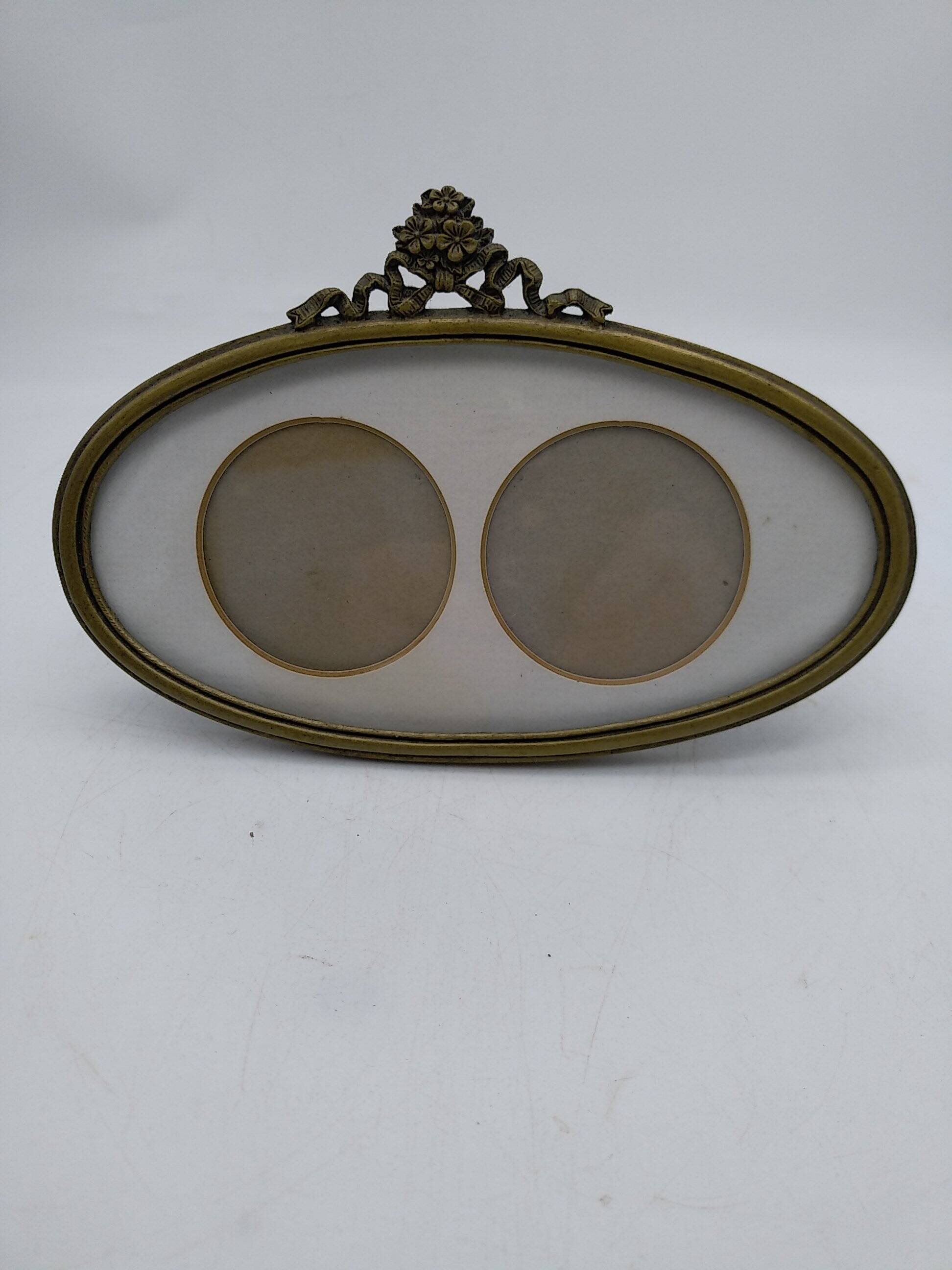 Oval brass photo frame circa 1900.