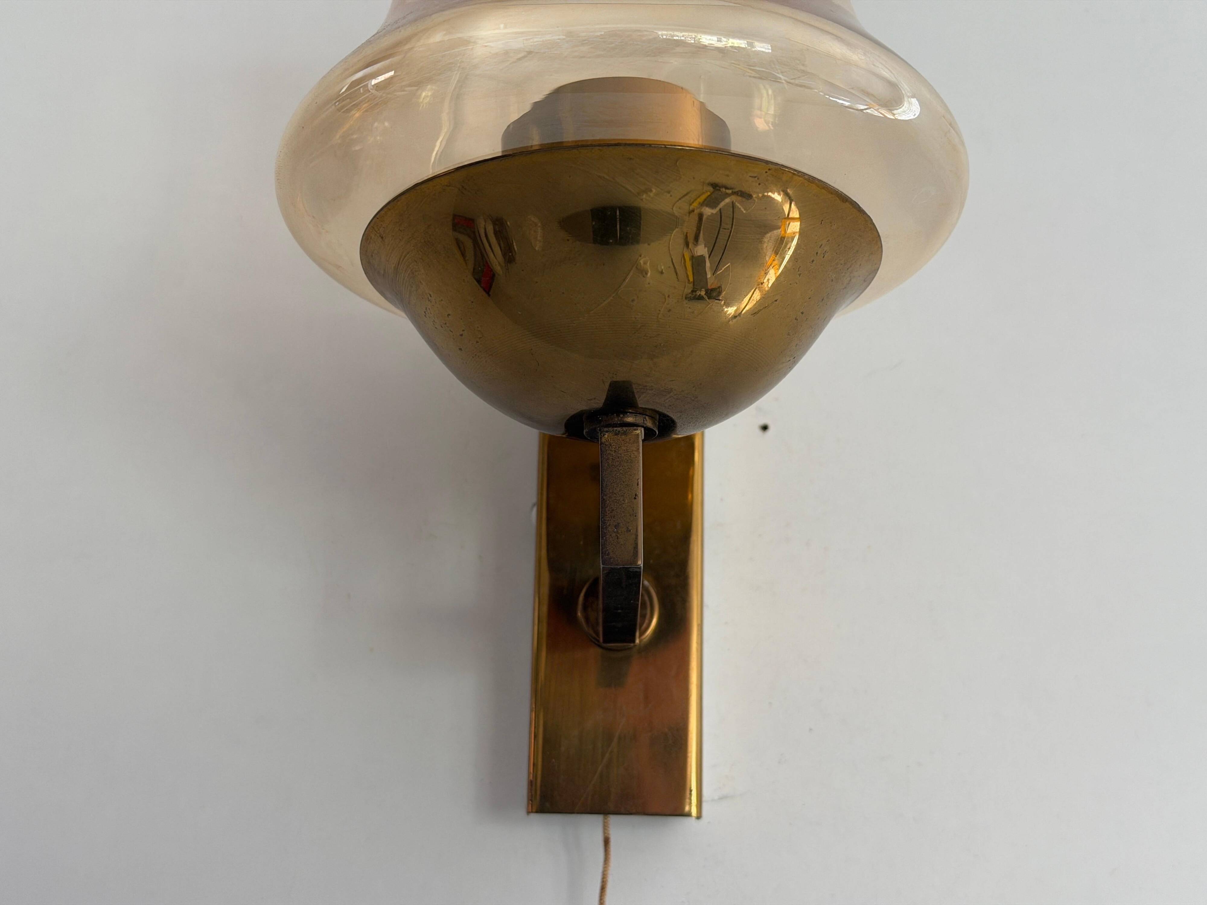Yellow glass and brass wall light from the mid-century, 1960, Germany.