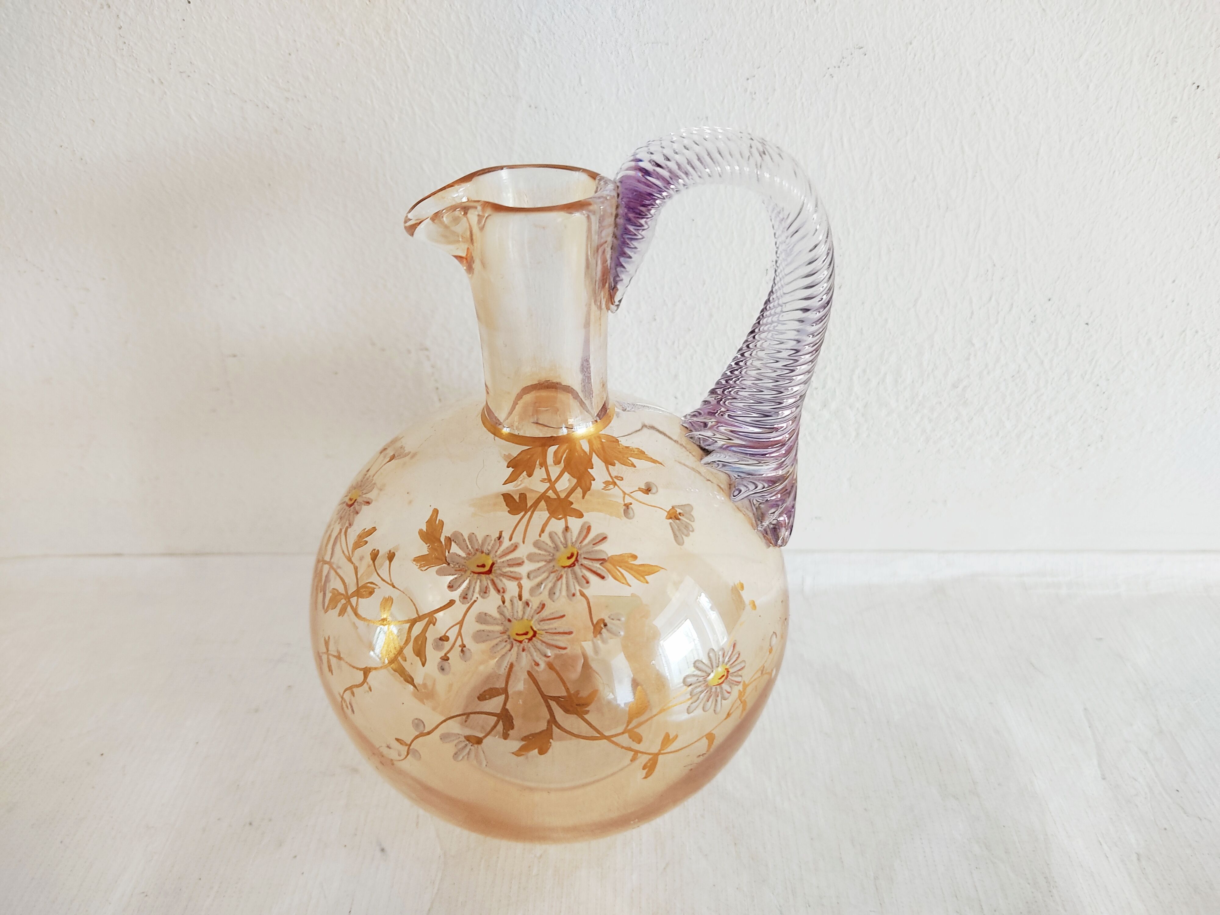 Glass pitcher decorated with 19th century flowers