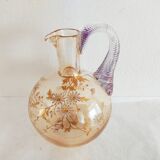 Glass pitcher decorated with 19th century flowers