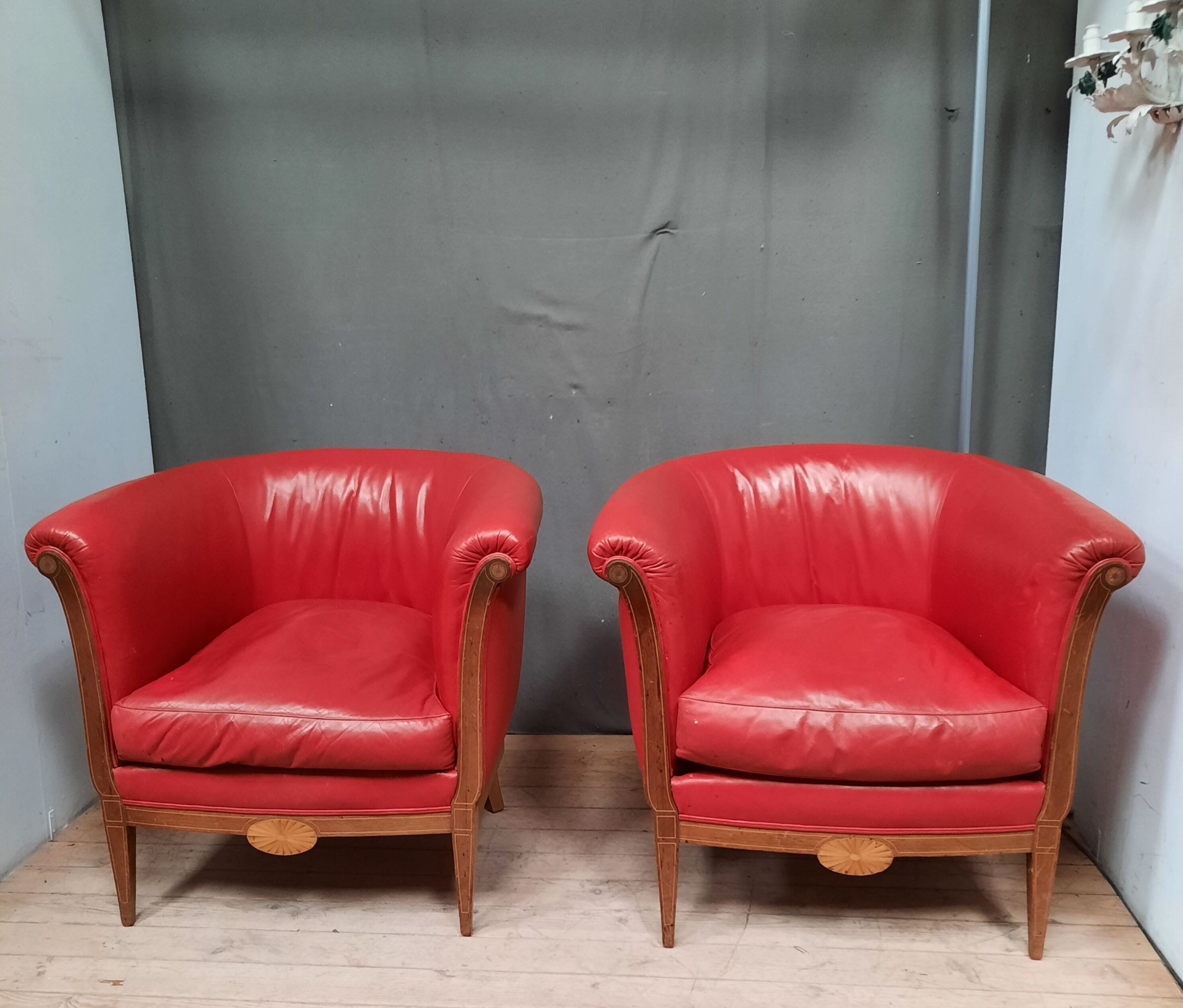 Pair of red leather armchairs