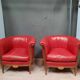 Pair of red leather armchairs