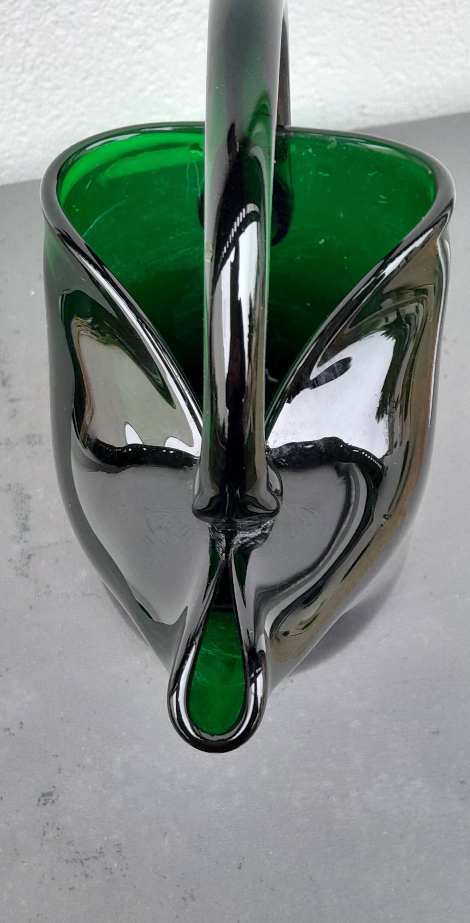 Blown glass pitcher filled