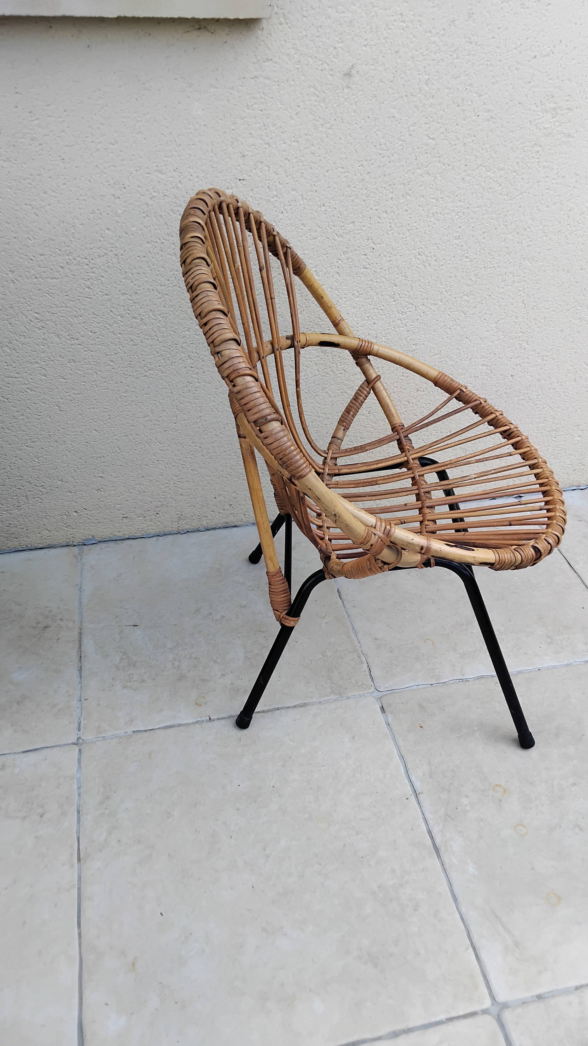 Vintage rattan armchair from the 50s and 60s.