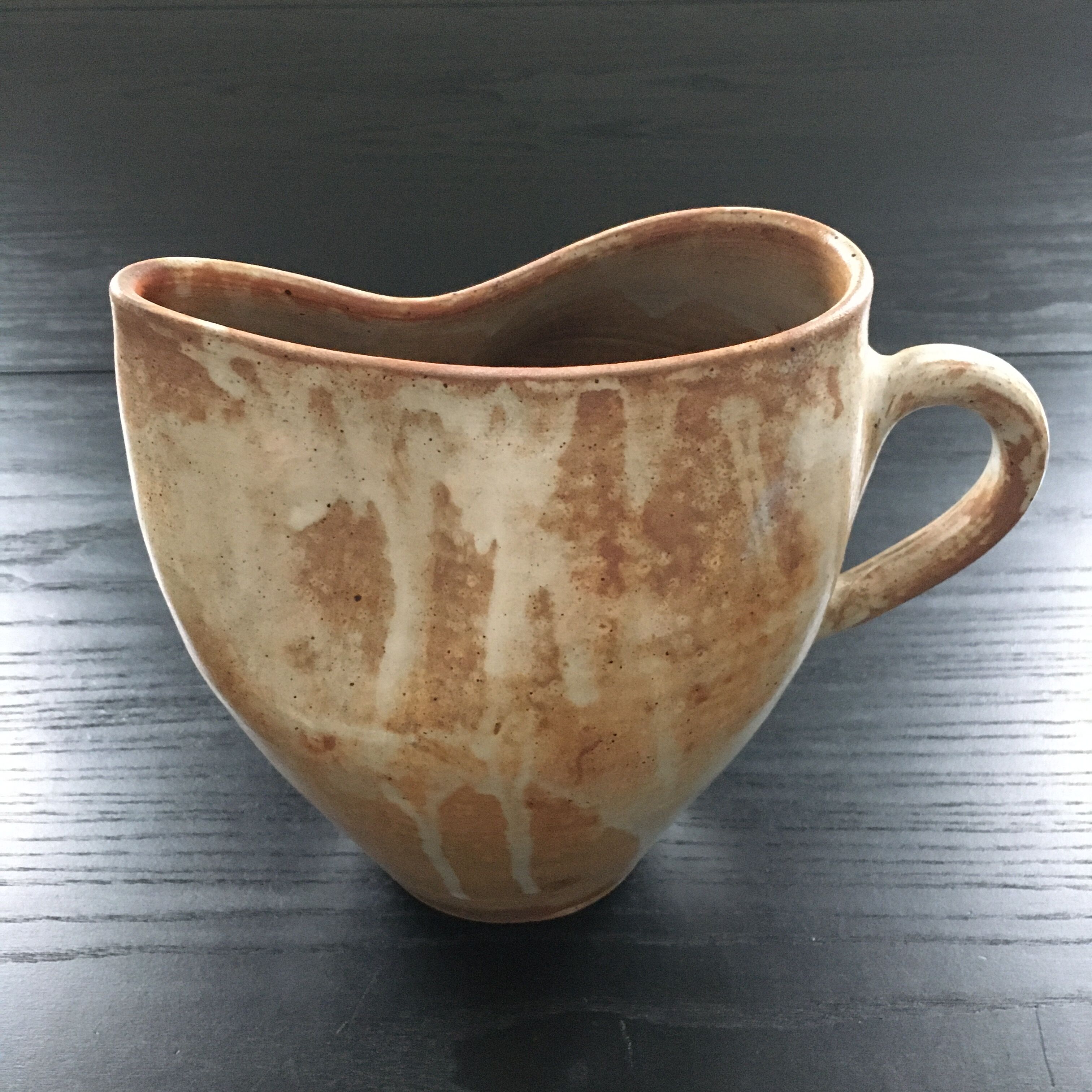 Beige stoneware pitcher with white drips