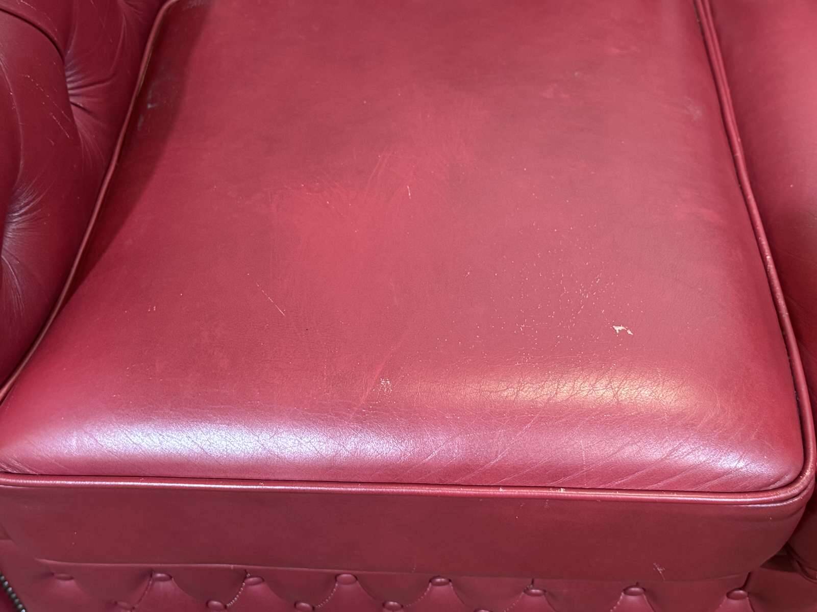 Chesterfield 2-seater leather sofa, modern production from the 2000s.