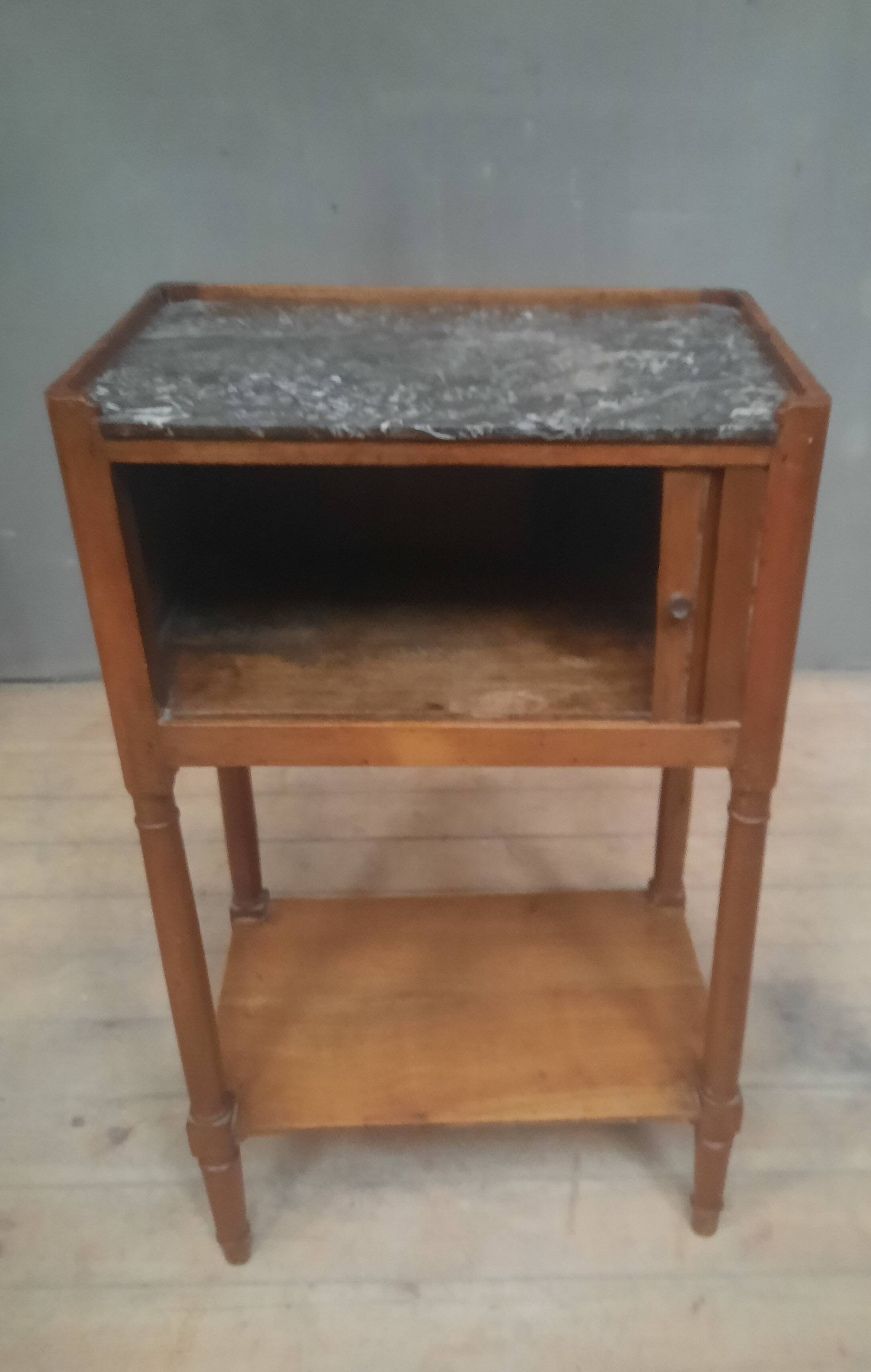 Curtained bedside table from the nineteenth century.