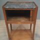Curtained bedside table from the nineteenth century.