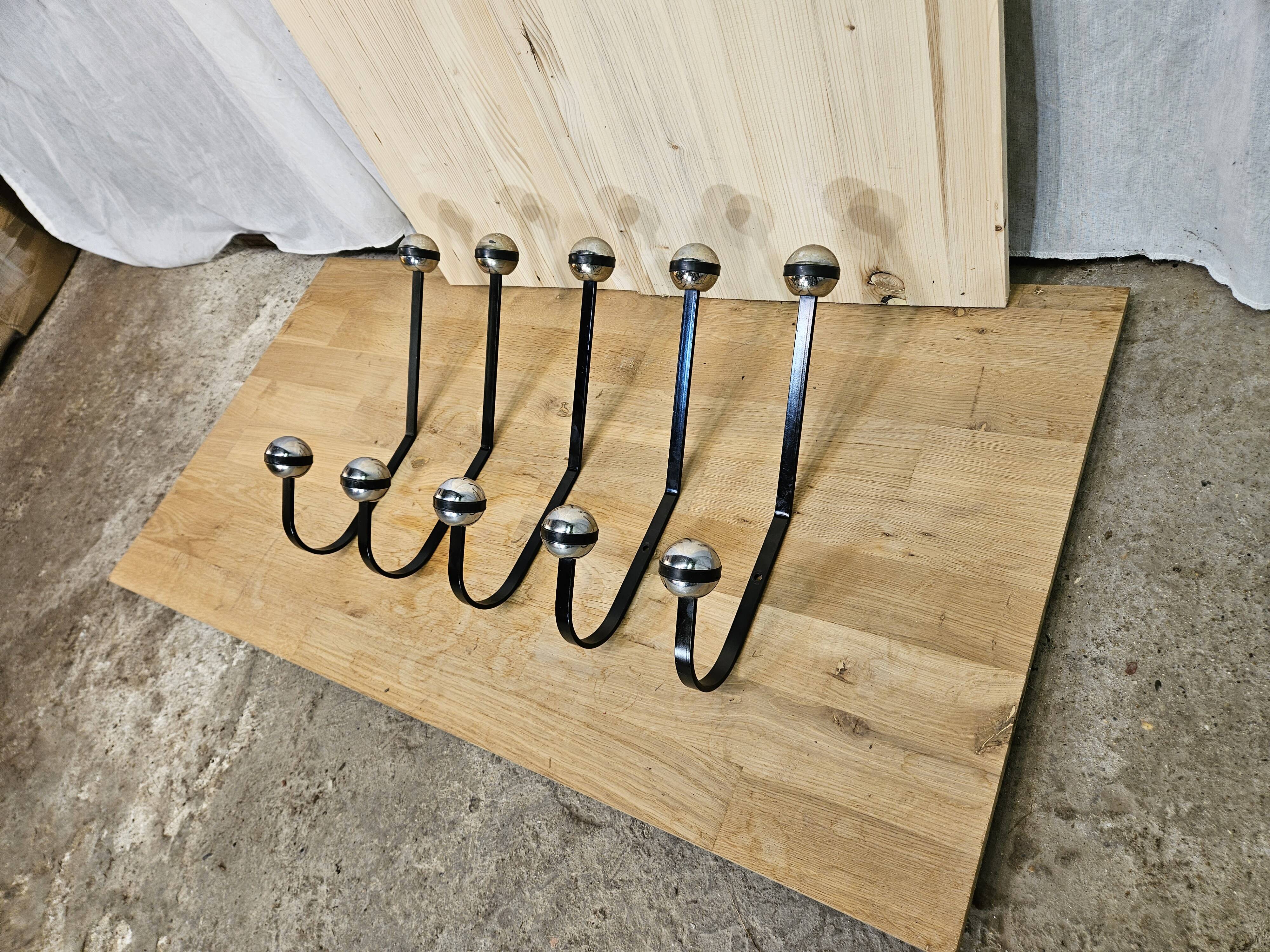 5 black and silver coat hooks from the 60s