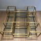 Important brass coffee table with multiple levels.