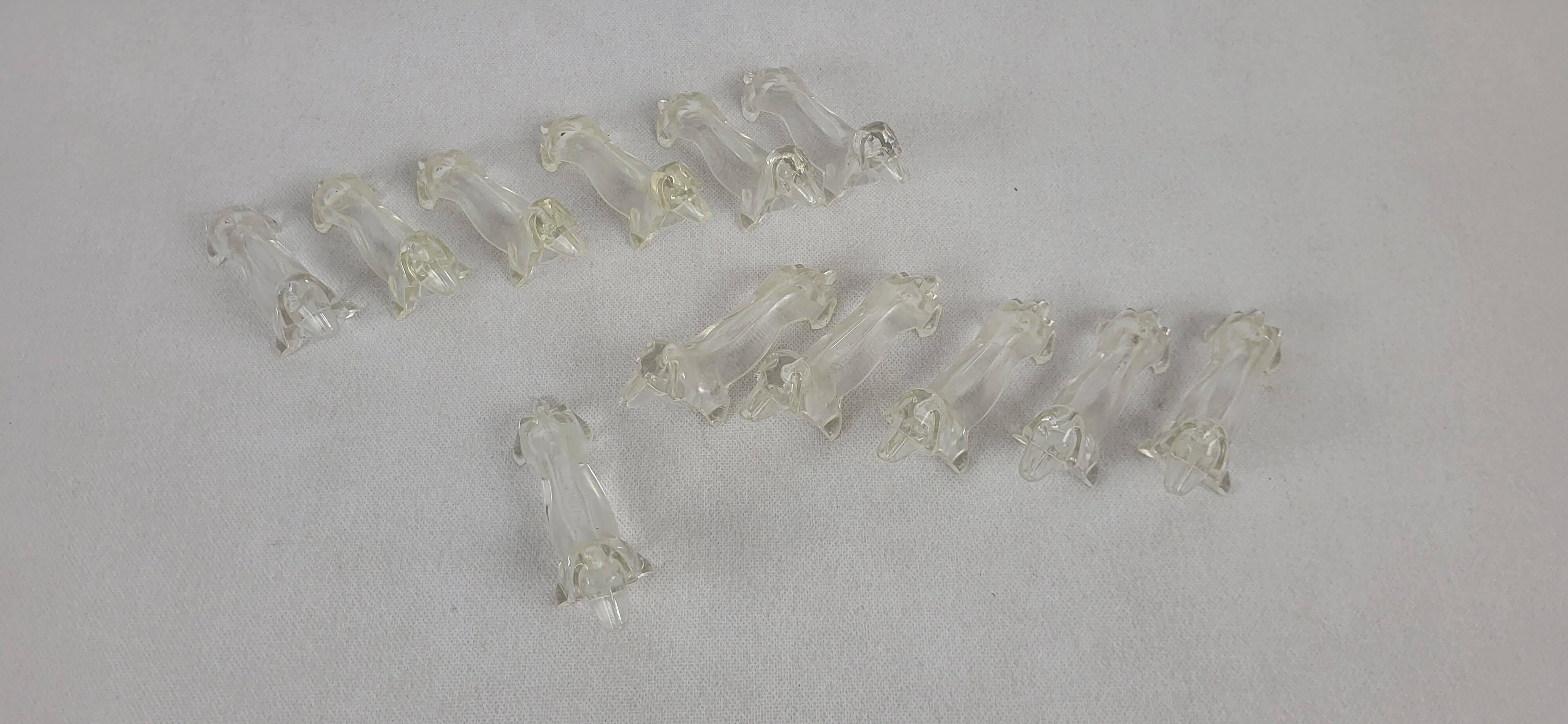 12 plastic dachshund/bassett knife holders 1970s