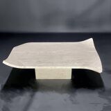 Travertine coffee table with curved corners by Claude Berraldacci. 1990s. France.