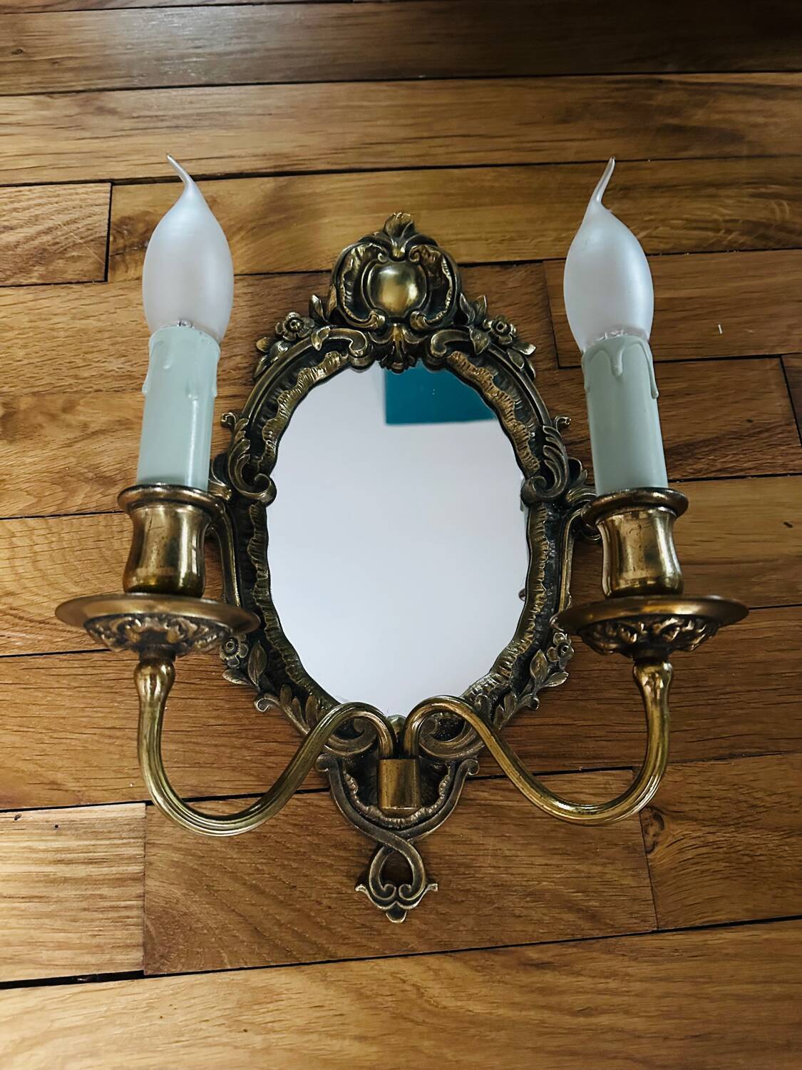 Antique bronze mirror wall sconce