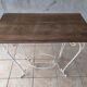 Old wrought iron and walnut table