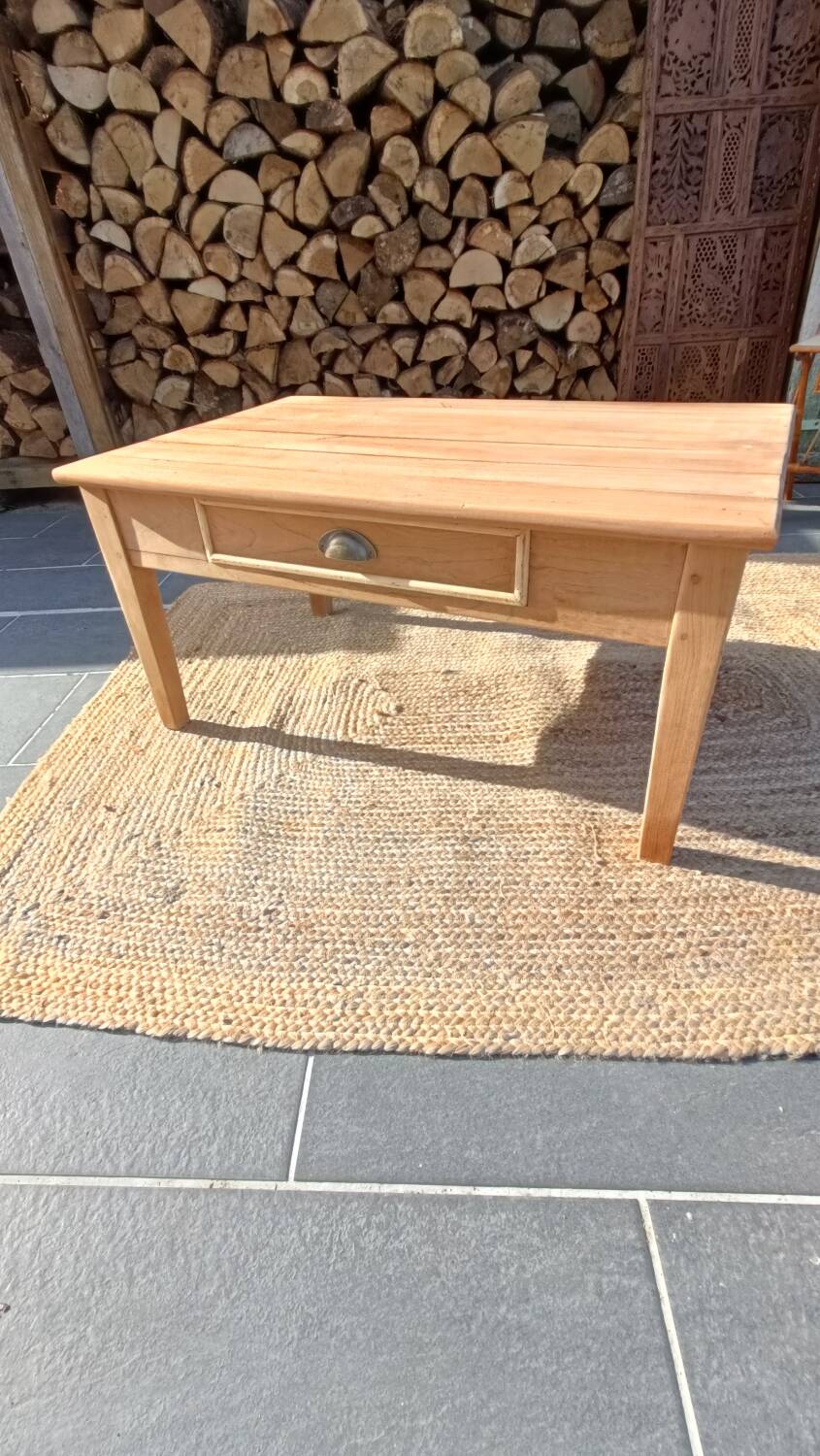 Low farmhouse table in raw wood
