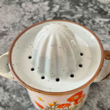 Vintage stoneware jug and its citrus juicer.