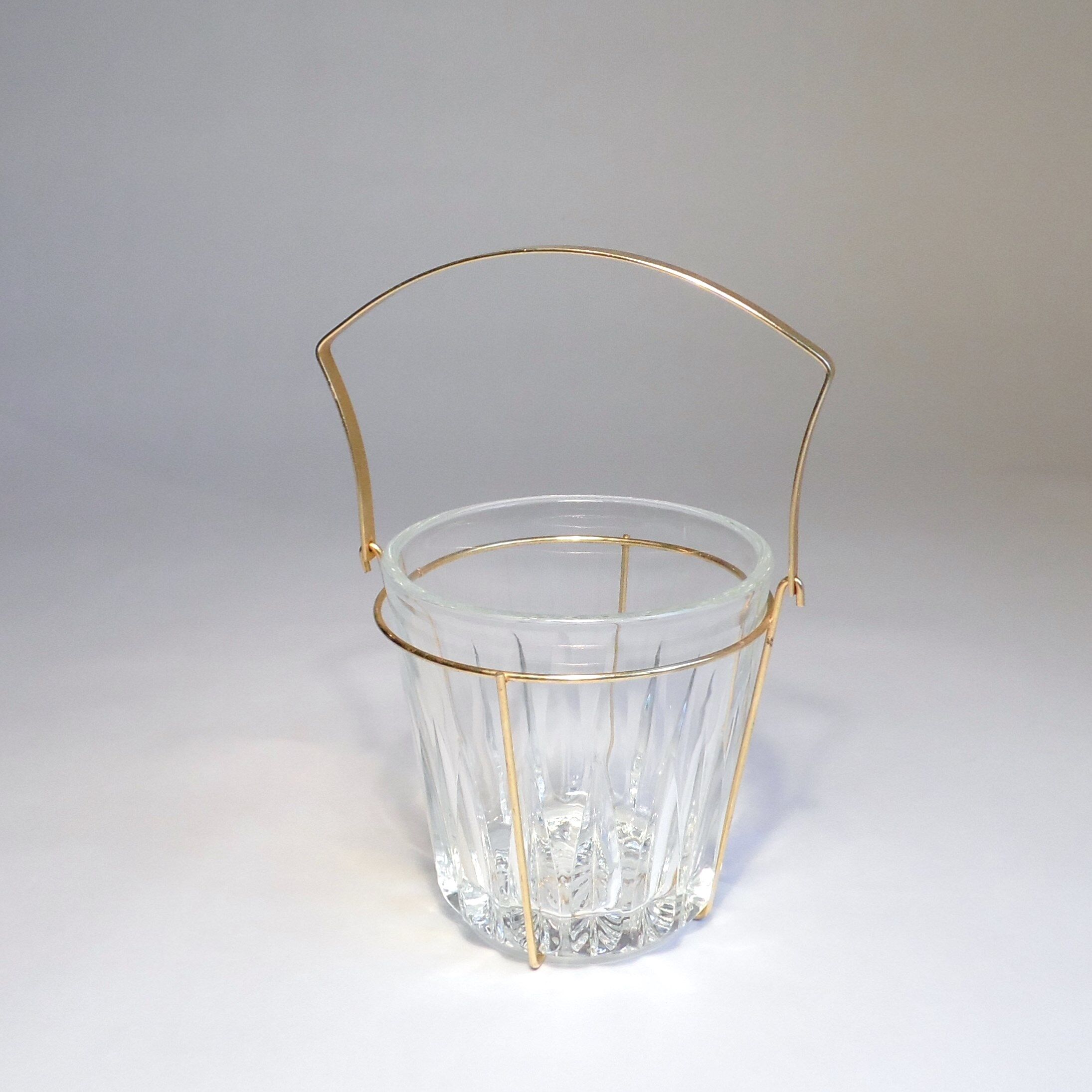 Glass and gold metal ice bucket