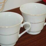 Set of 2 white porcelain cups with gold rim