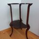 Triplet console harness in carved wood