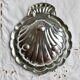 Vintage shell-shaped shiny silver-plated catchall.
