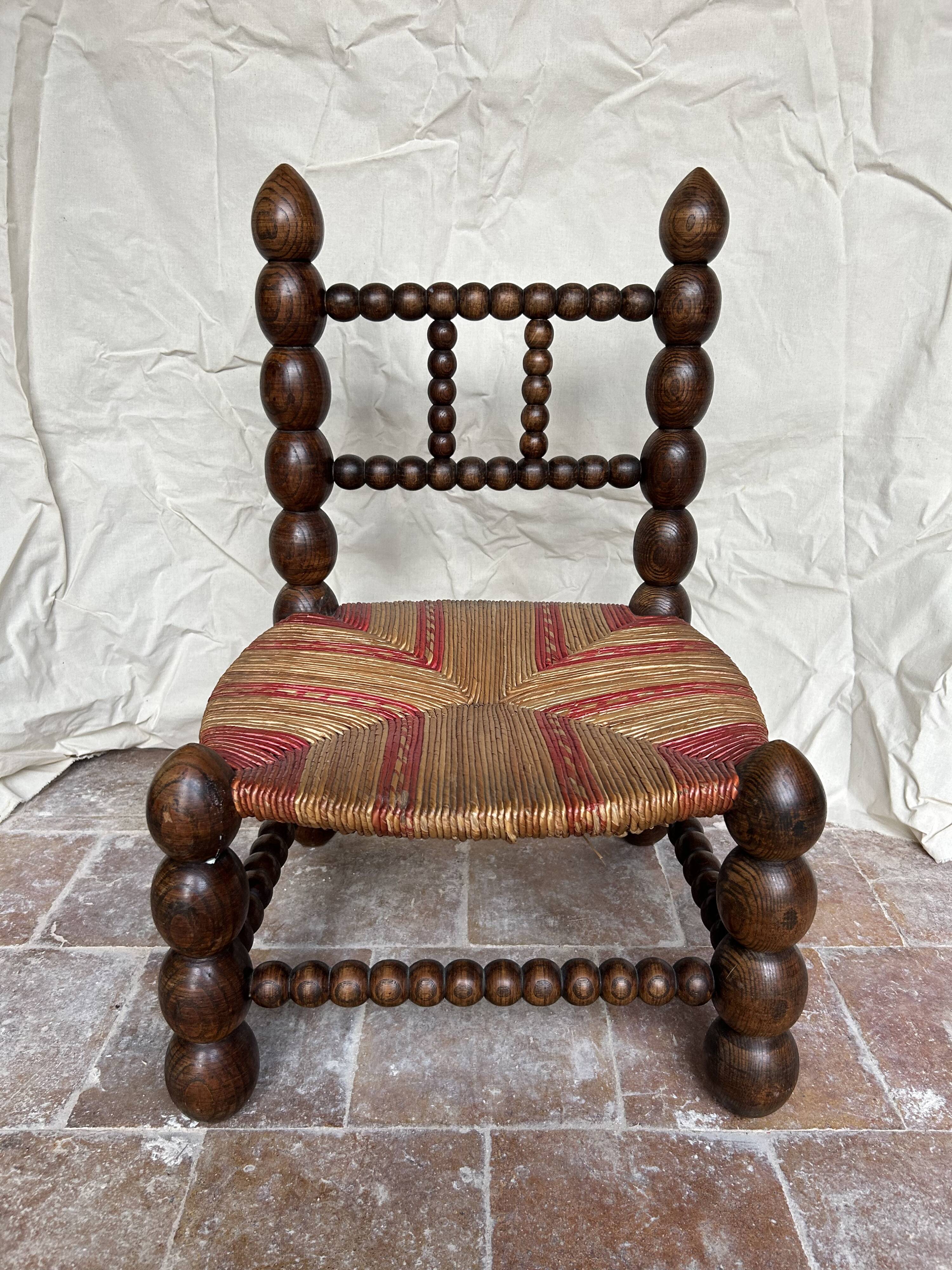 Turned wooden chair by Charles Dudouyt
