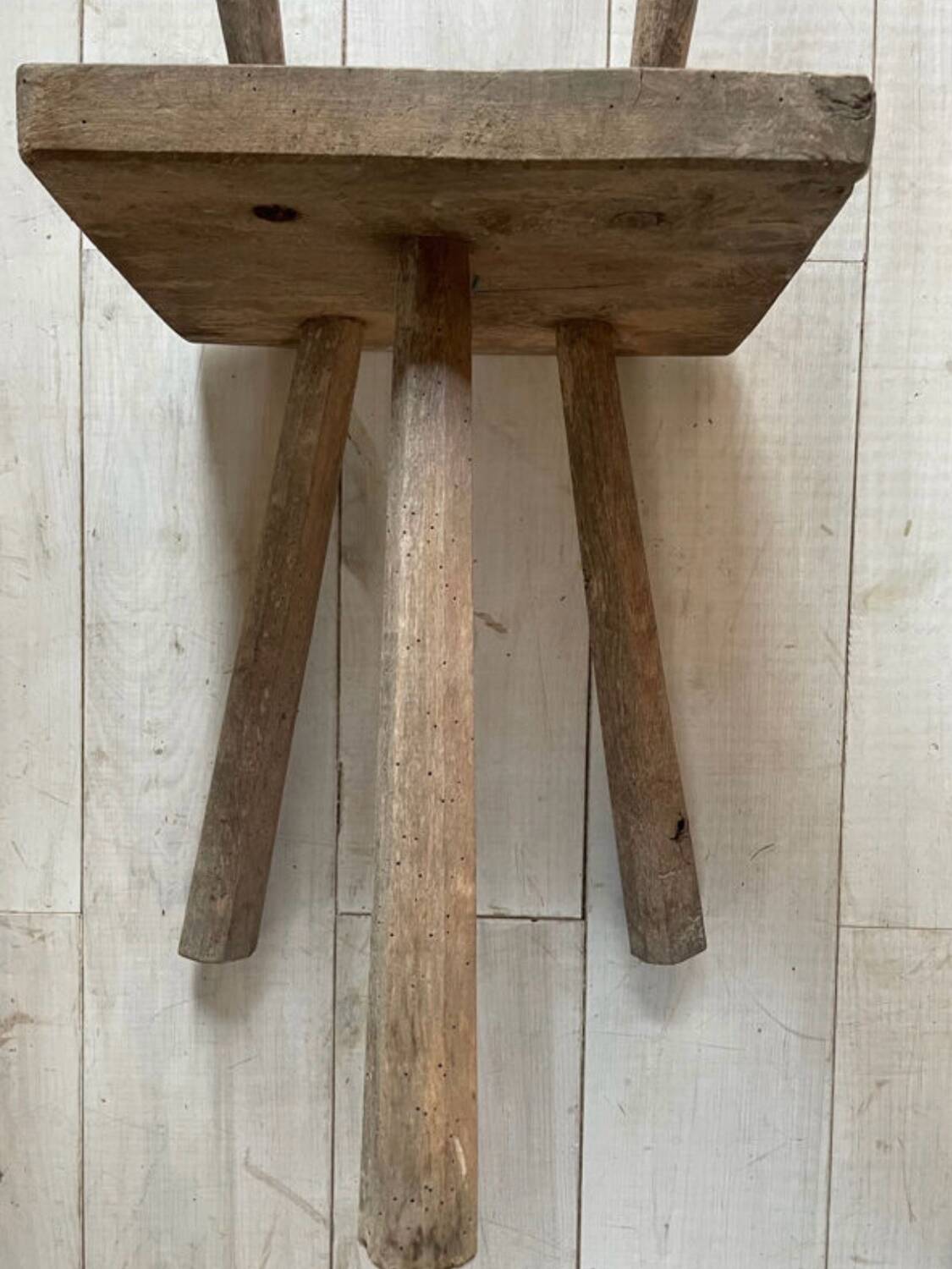 Set of three wooden tripod chairs in oak, raw art.