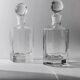 Lot of vintage 1970s consisting of 2 hexagonal glass carafes, transparent glass with spherical stoppers.