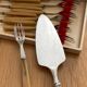 12 pie forks and 1 shovel