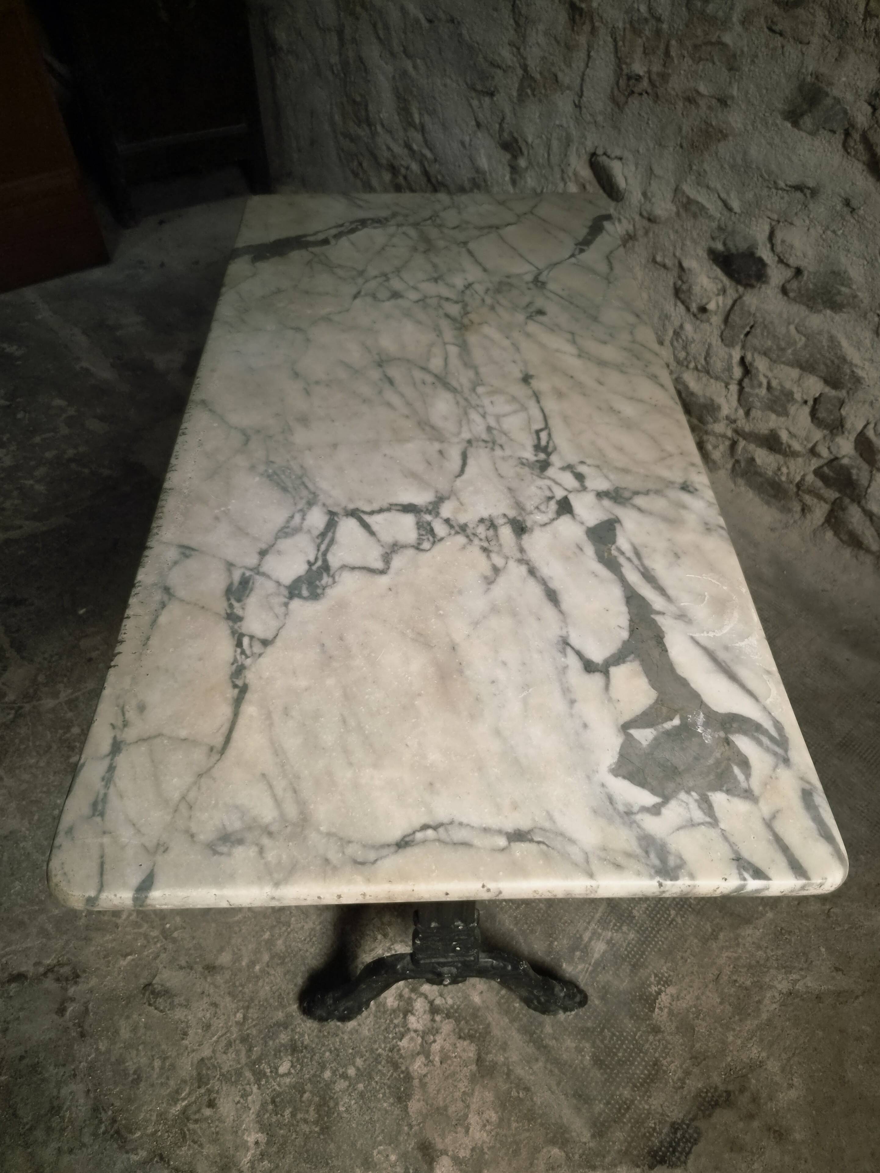 French bistro table made of marble with a cast iron base, 1920s–1930s.